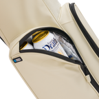A close up shot of Cream El Camino S-class golf bag's insulated pocket with a canned drink inside
