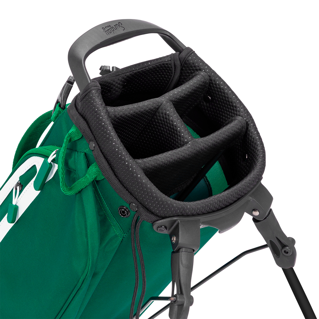 Close-up of a green golf bag with a black stand on a white background