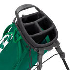 Close-up of a green golf bag with a black stand on a white background