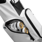 A close up shot of El Camino S-Class golf bag in white vegan leather showing off its frosty pocket with canned drinks inside