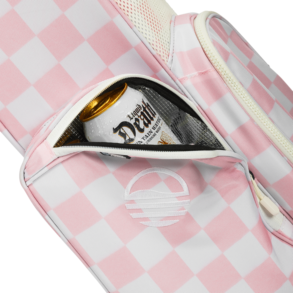 A close up shot of Pink/White Checker El Camino golf bag's insulated pocket with a canned drink inside
