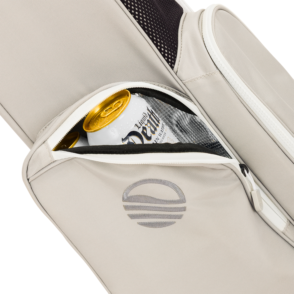 A close up shot of Cool Gray El Camino golf bag's insulated pocket with a canned drink inside
