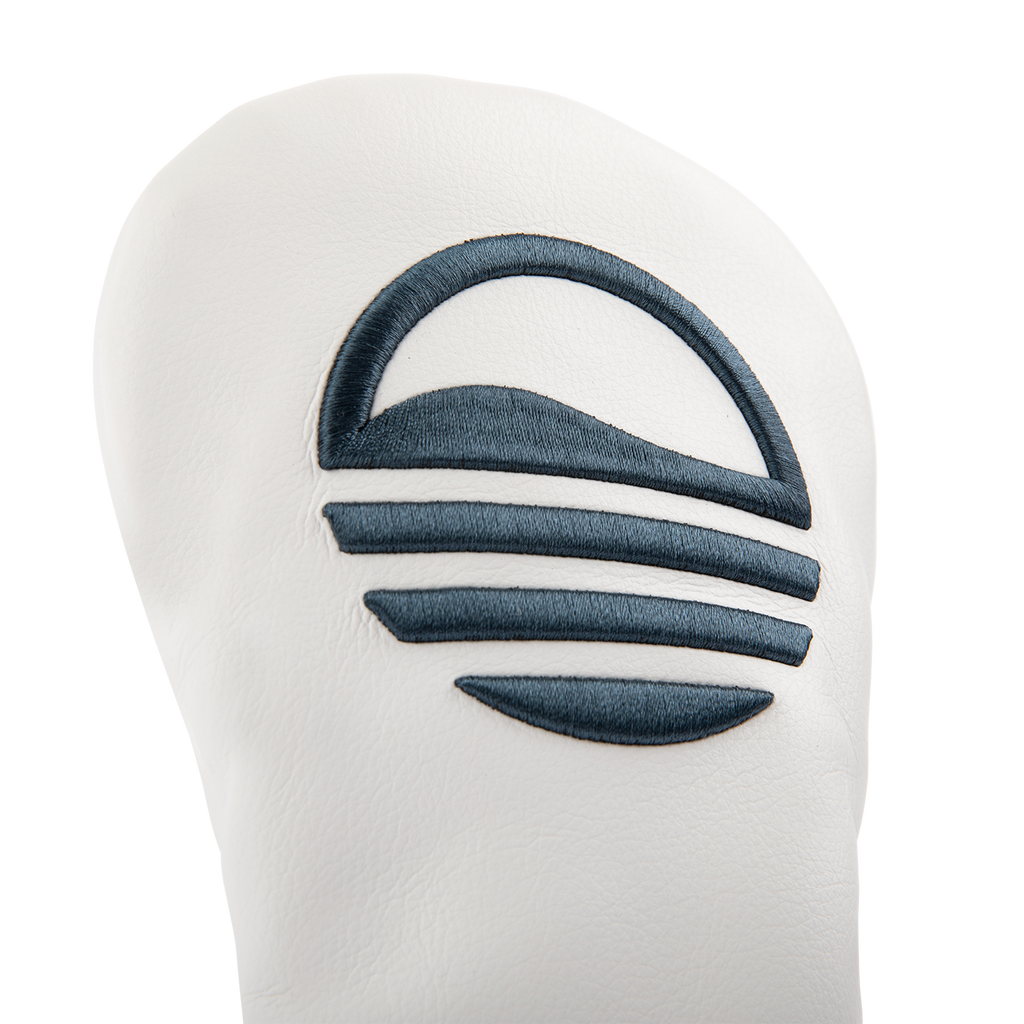 Close up shot of fairway wood golf headcover in white and navy vegan leather showing its material and Sunday Golf logo
