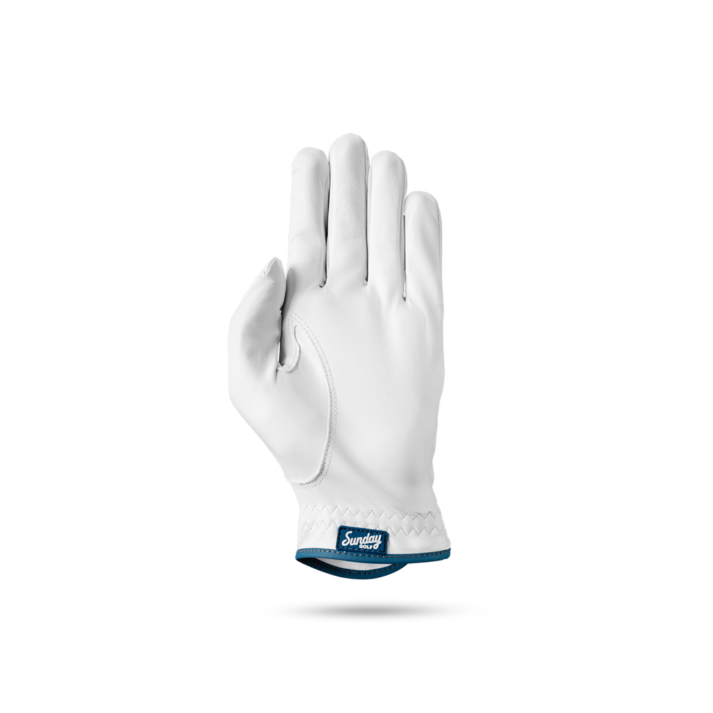 The front of leather golf glove in navy and white color showing Sunday Golf logo at its seams