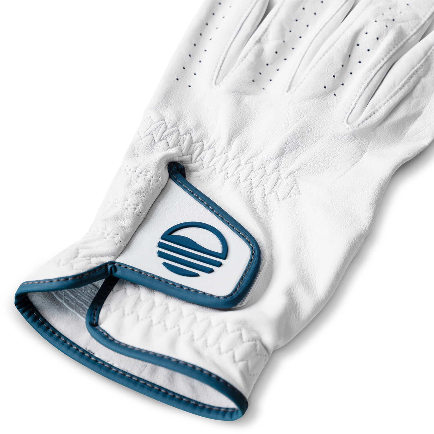 Close up shot of leather golf glove in navy and white color showing its velcro closure with Sunday Golf logo