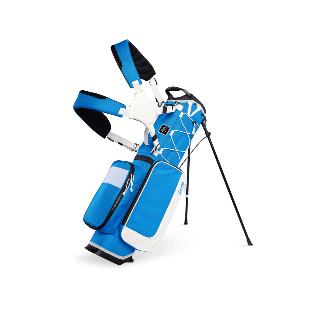 A full front shot of a blue & white Recess kids golf bag with double straps
