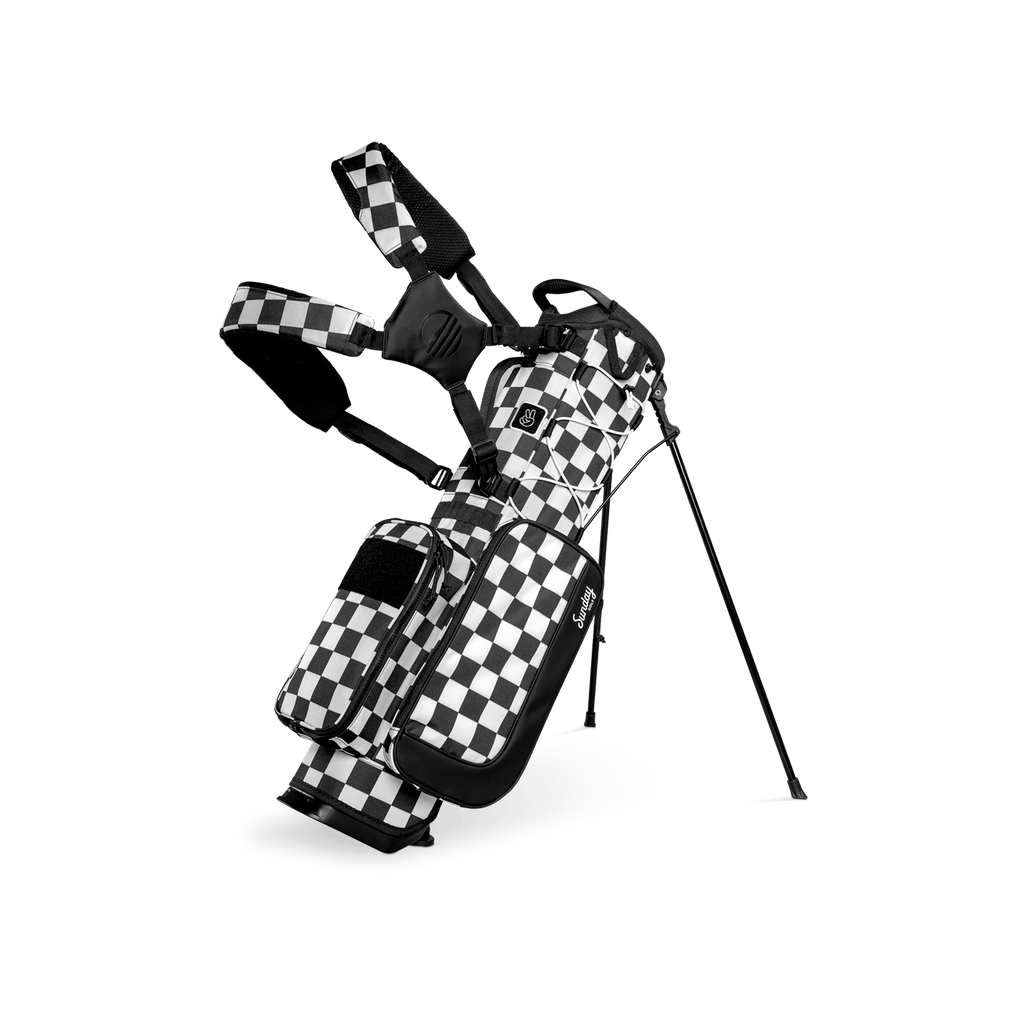 A full front shot of a checkered Black & White Recess kids golf bag with double straps
