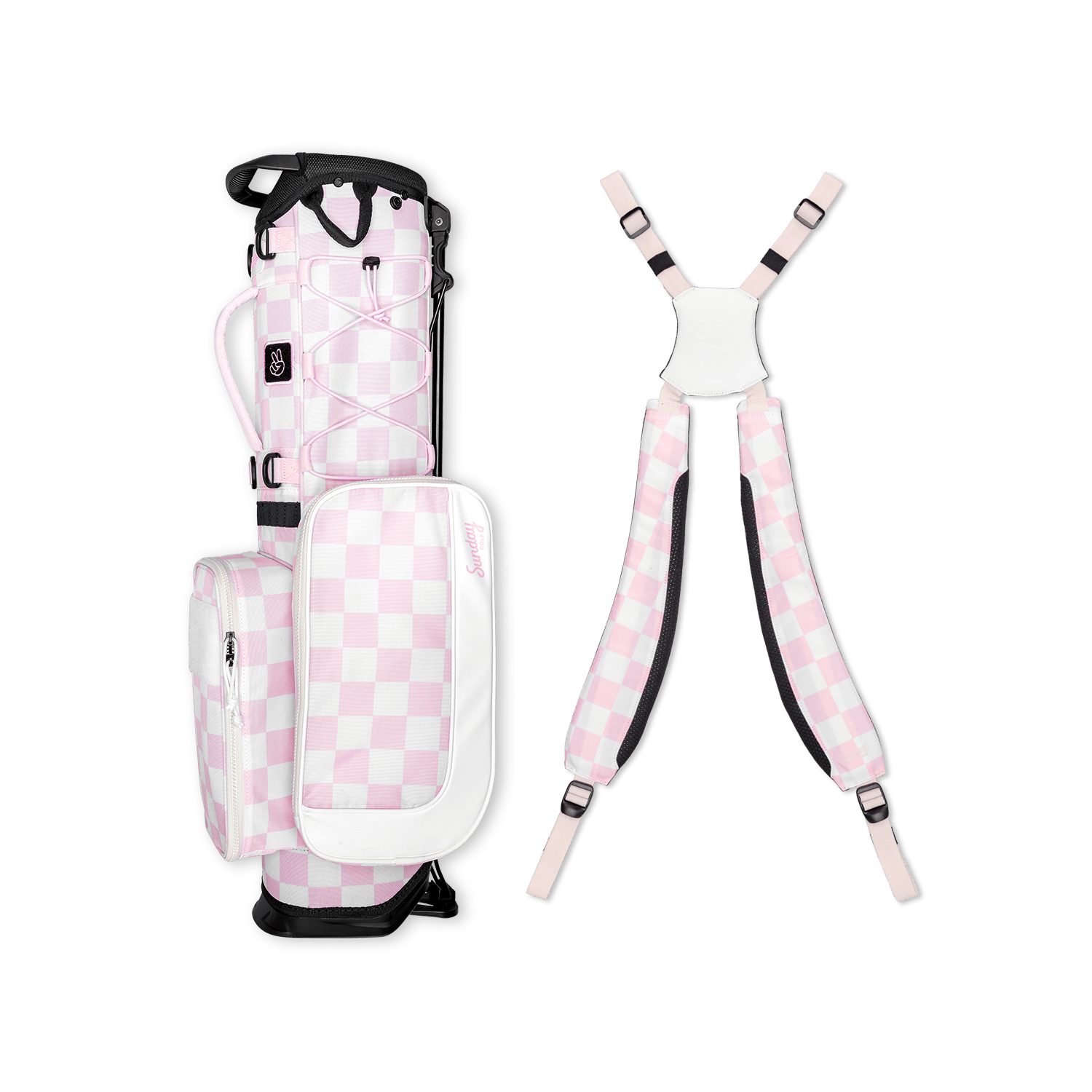 A full shot of a checkered Pink & White Recess kids golf bag laying flat sideways beside its double straps
