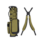 A full shot of a Patton Green Recess kids golf bag laying flat sideways beside its double straps
