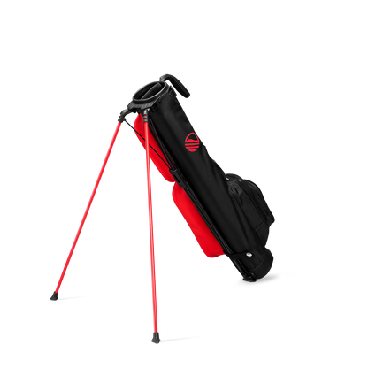 A full shot of standing Loma golf bag in blackjack facing backward
