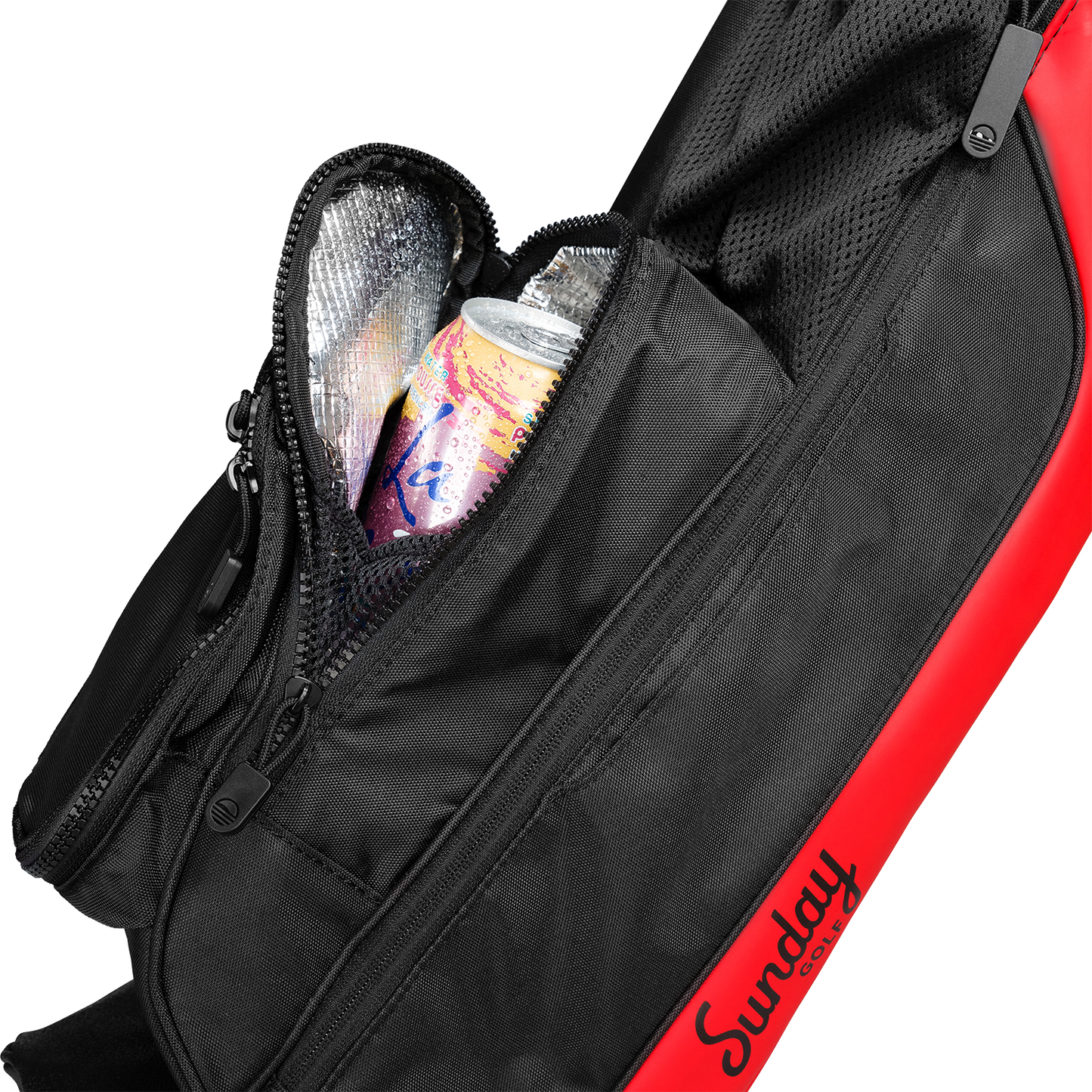 A close up shot of toasted almond Loma golf bag's insulated pocket with a canned drink inside
