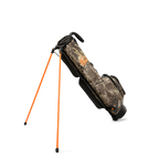 A full shot of standing Loma golf bag in mossy oak country dna facing backward