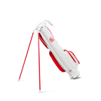 A full shot of standing Loma golf bag in red & off-white facing backward