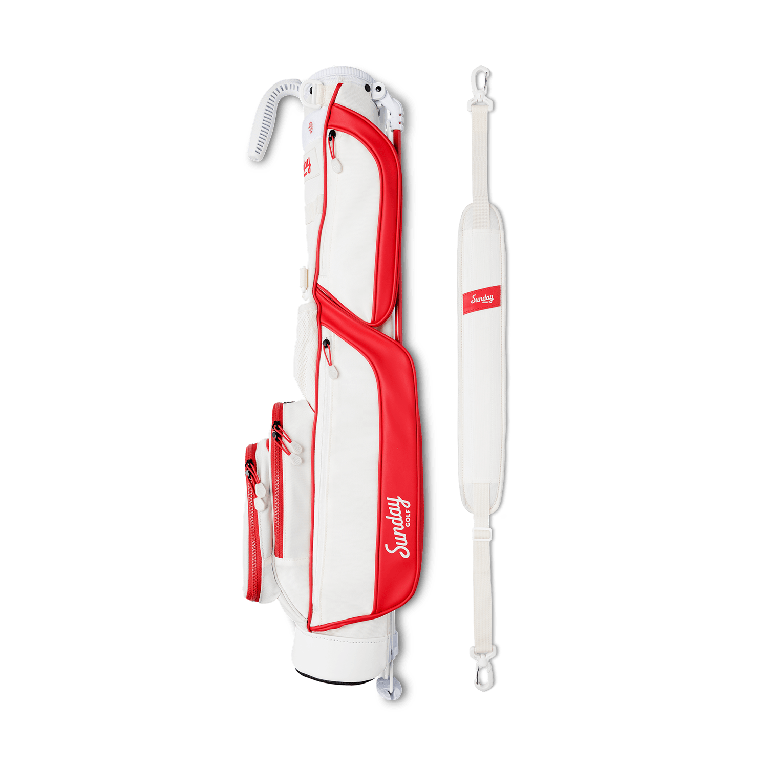A full shot of Loma golf bag in red & off-white laying flat sideways beside its single strap