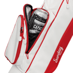 A close up shot of red & off-white Loma golf bag's insulated pocket with a canned drink inside