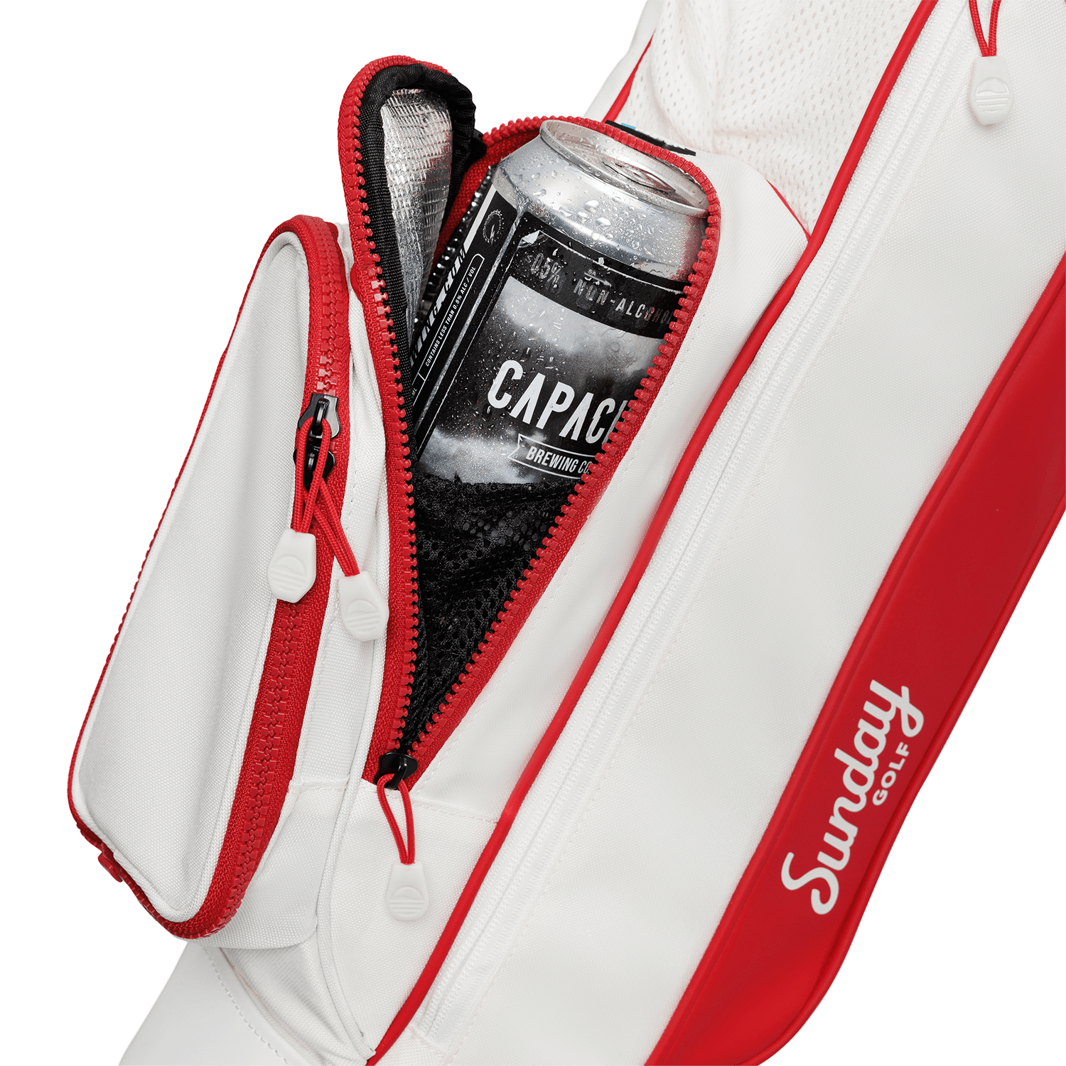 A close up shot of red & off-white Loma golf bag's insulated pocket with a canned drink inside