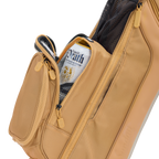 Tan leather bag with a close-up shot of the bag's pocket on a white background