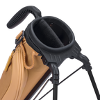 Close-up of a golf bag with a black stand and handle on a white background