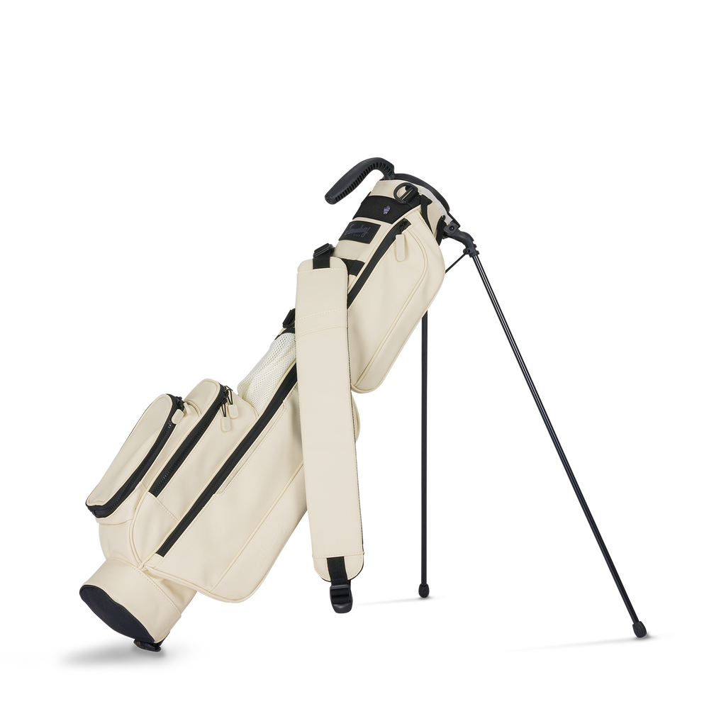 A full front shot of standing Loma S-Class golf bag in Cream with single strap

