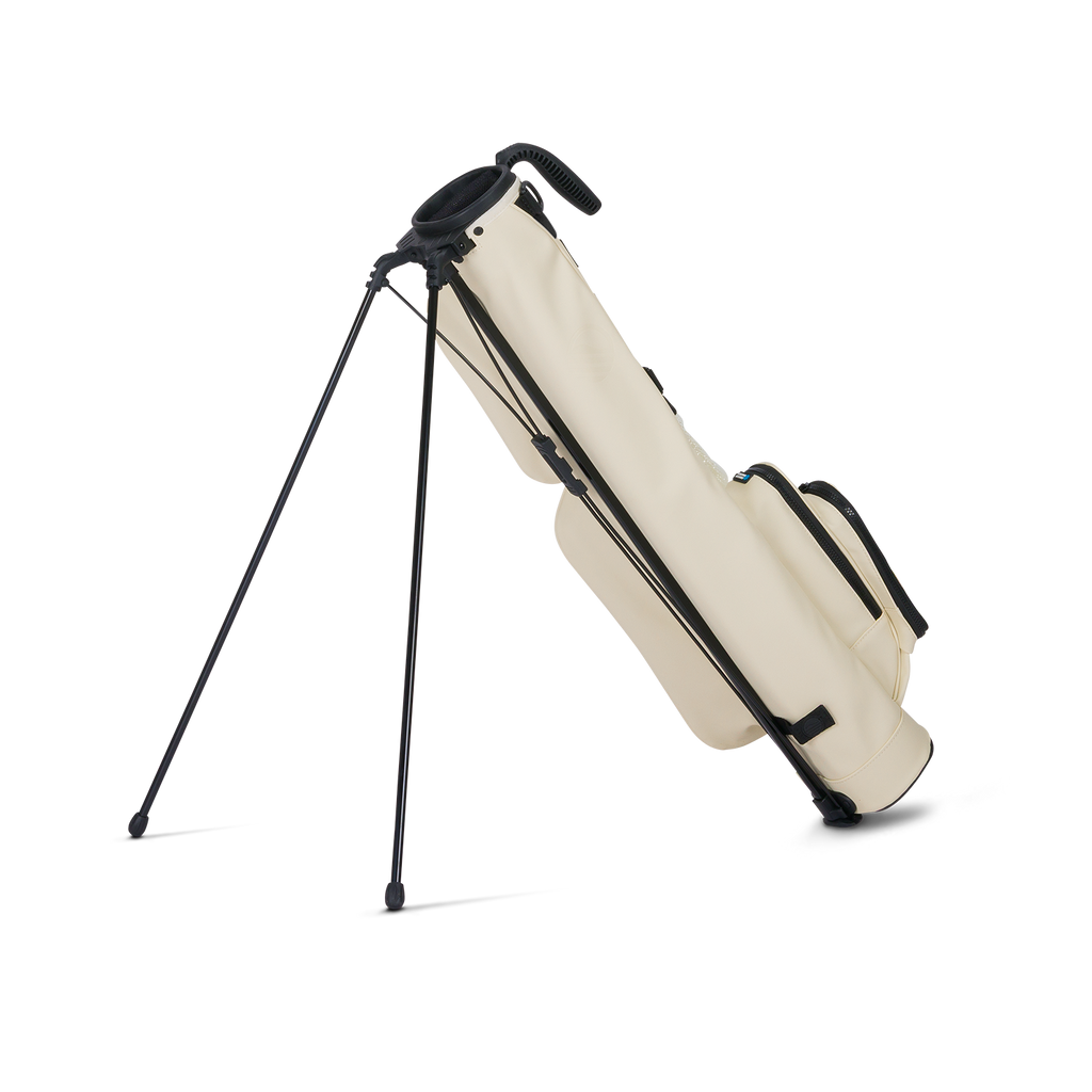 A full shot of standing Loma S-Class golf bag in Cream facing backward
