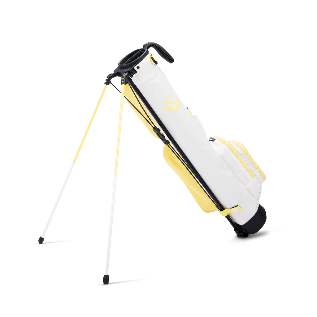 A full shot of standing Loma golf bag in Mindy Lemon facing backward