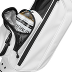 A close up shot of white vegan leather Loma XL S-Class golf bag's frosty pocket with canned drinks inside