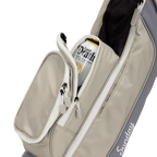 A close up shot of Cool Gray Loma golf bag's insulated pocket with a canned drink inside
