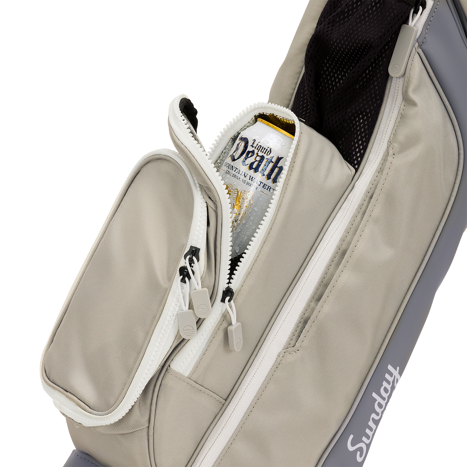 A close up shot of Cool Gray Loma golf bag's insulated pocket with a canned drink inside
