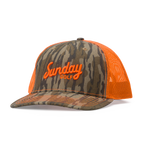 Front shot of the mossy oak bottomland orange trucker golf hat