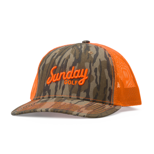 Front shot of the mossy oak bottomland orange trucker golf hat
