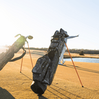 A man playing on the course with a mossy oak country dna Loma golf bag behind him