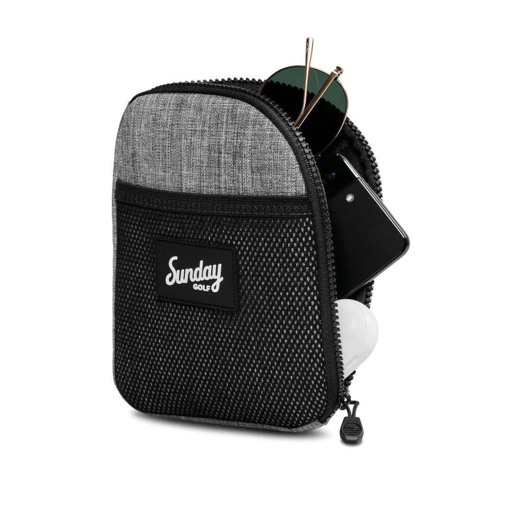 Heather gray nickel bag valuables pouch unzipped with items showing from inside