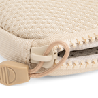 A close up shot of toasted almond nickel bag's zipper