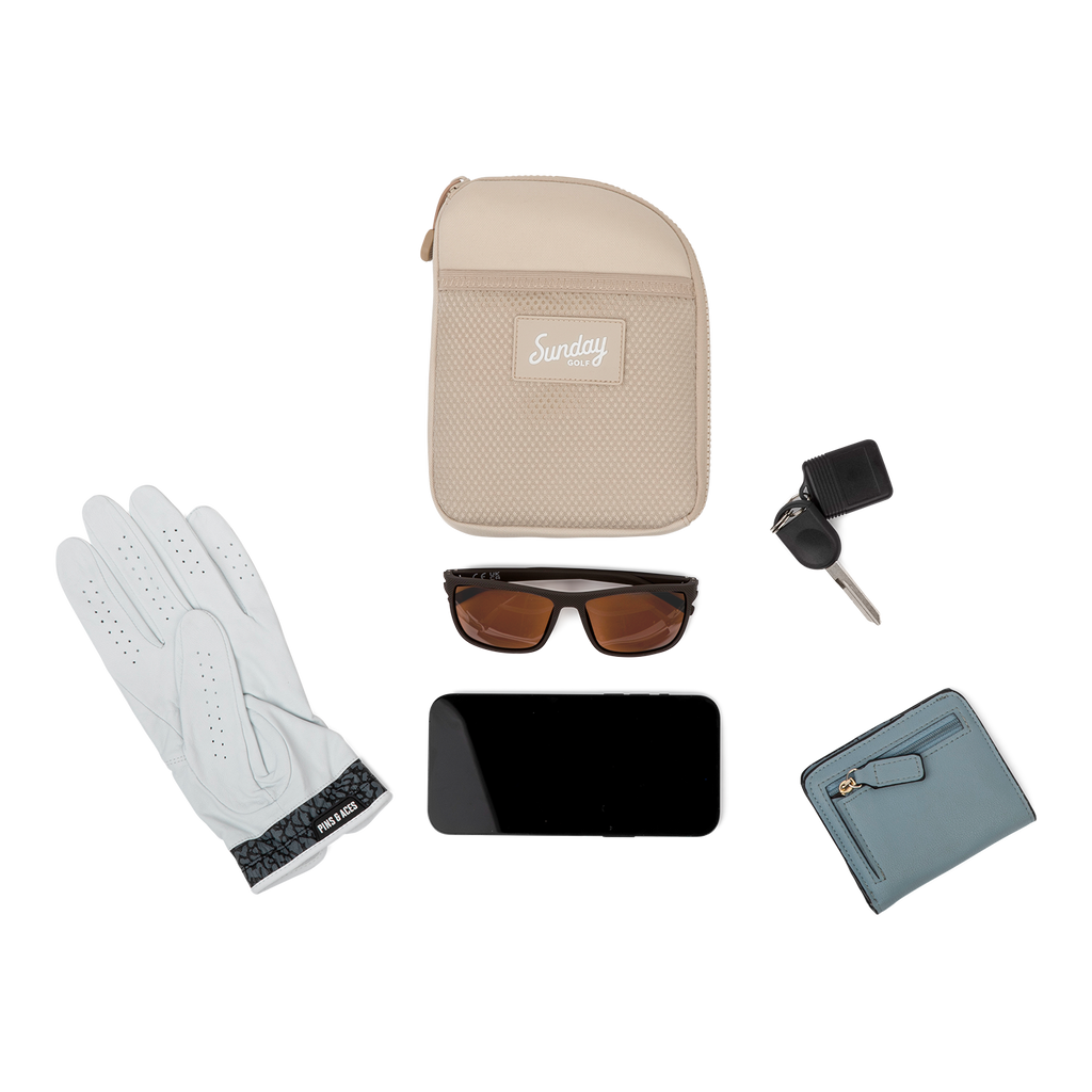 Toasted almond nickel bag valuables pouch laying flat with items it can hold 