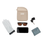 Toasted almond nickel bag valuables pouch laying flat with items it can hold 