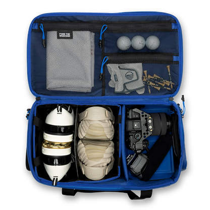 Sunday Golf's Creator Duffle Bag Blue showcasing compartments containing sports equipment