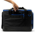 Sunday Golf's Creator Duffle Bag Blue  with a hand gripping the handle
