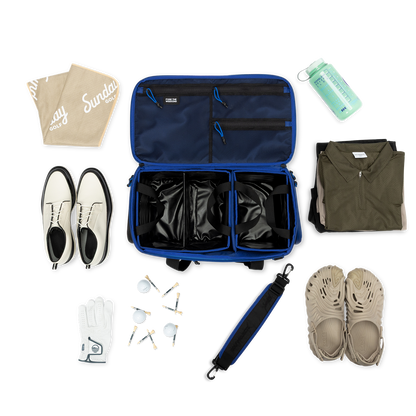 Sunday Golf's Creator Duffle Bag Blue showcasing Collection of travel items including shoes, clothing, and accessories