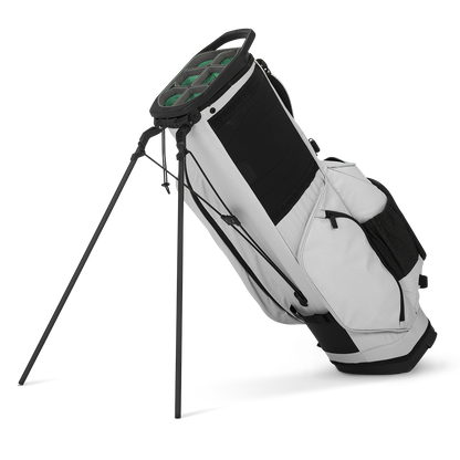 A full shot of standing Ranger golf bag in Off Gray facing backward
