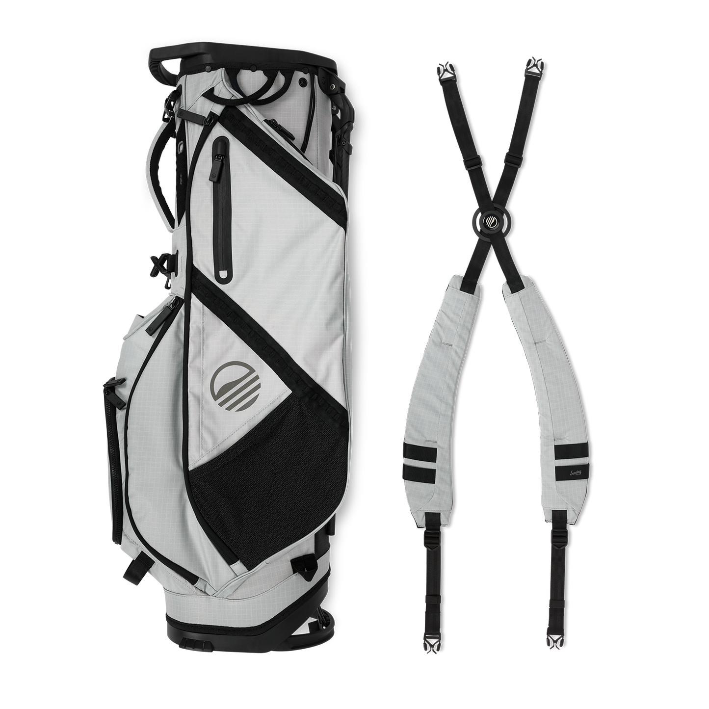 A full shot of Ranger golf bag in Off Gray laying flat sideways beside its double strap
