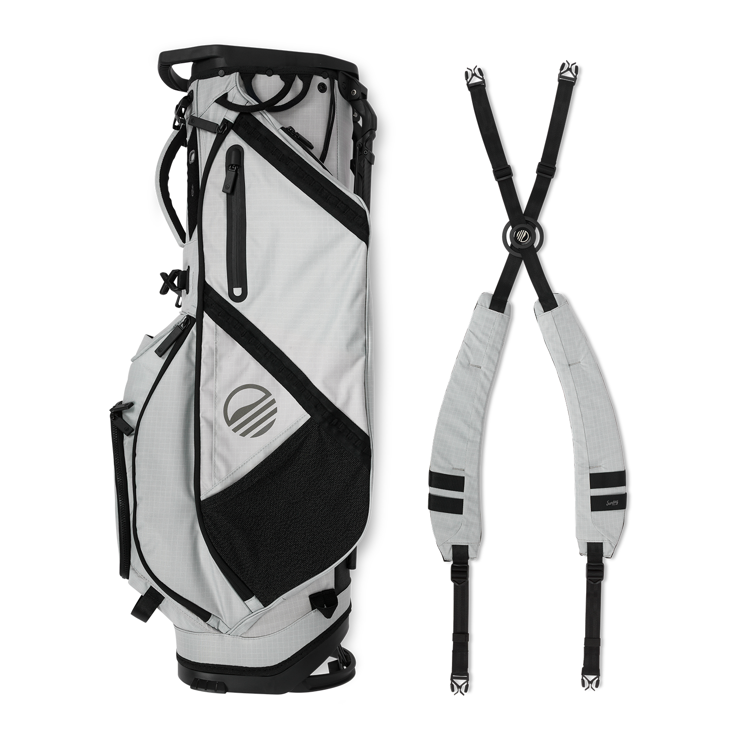A full shot of Ranger golf bag in Off Gray laying flat sideways beside its double strap
