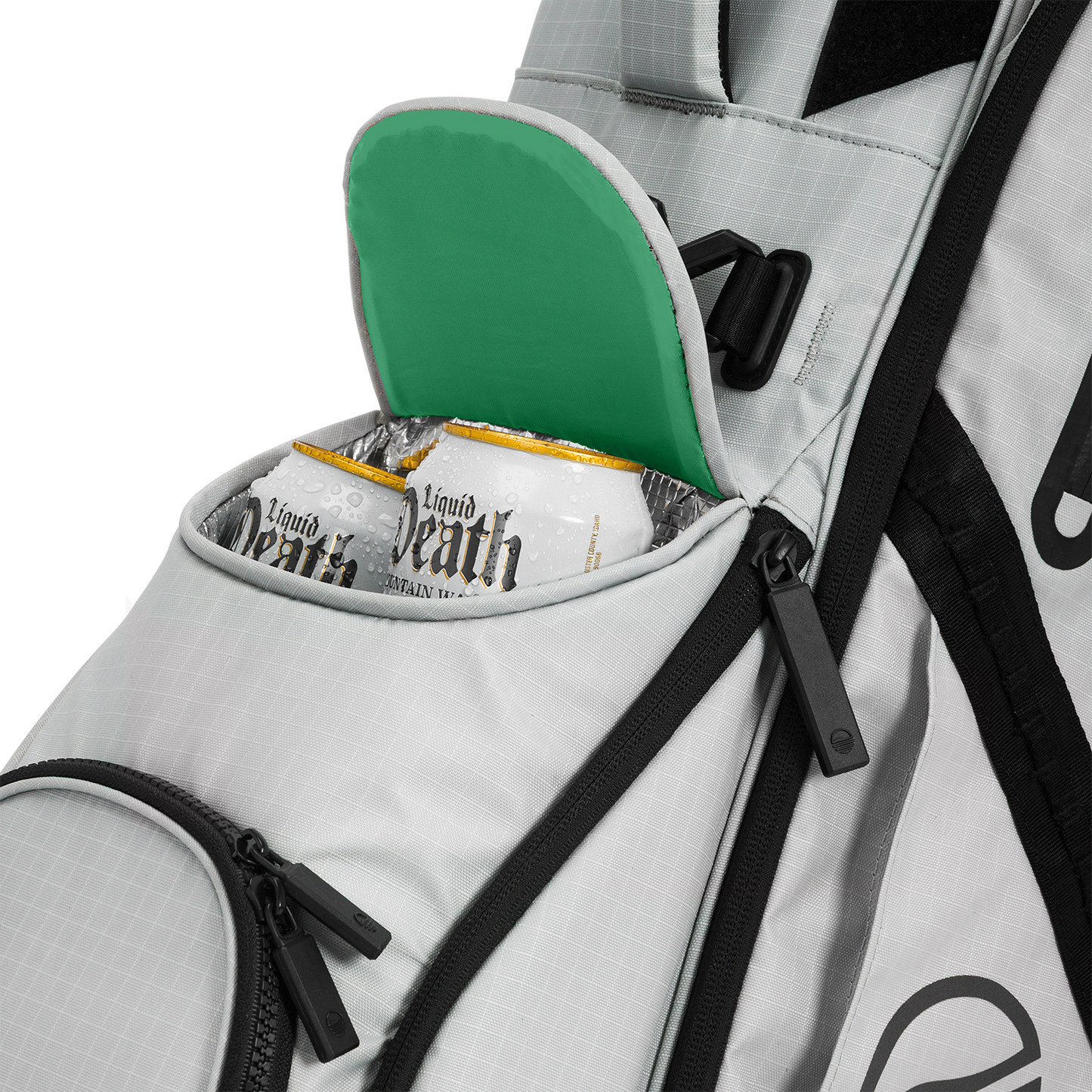 A close up shot of Off Gray Ranger golf bag's frosty pocket with canned drinks inside
