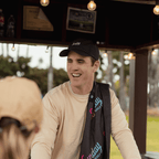 Miami Vice golf towel on Ronan's shoulder