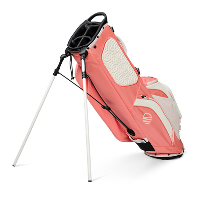 A full shot of standing Ryder golf bag in coral facing backward