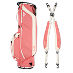 A full shot of Ryder golf bag in coral laying flat sideways beside its double strap