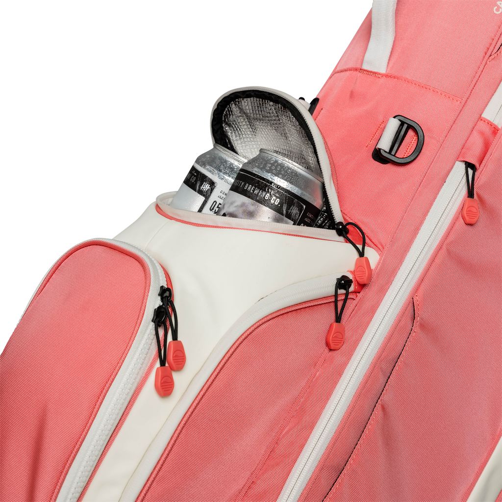 A close up shot of coral Ryder golf bag's frosty pocket with canned drinks inside