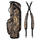 A full shot of Ryder golf bag in mossy oak country dna laying flat sideways beside its double strap