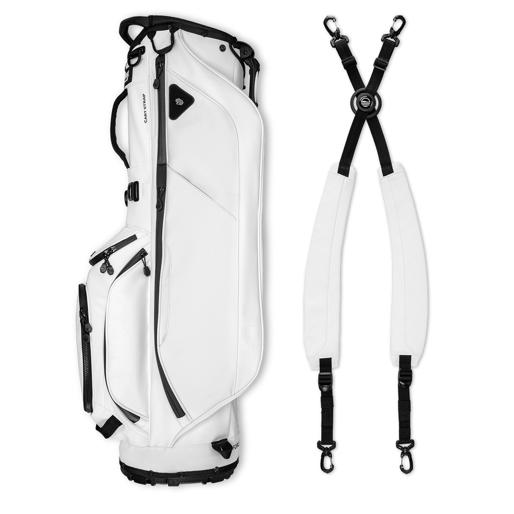 A full shot of Ryder S-Class golf bag in white vegan leather laying flat sideways beside its double strap