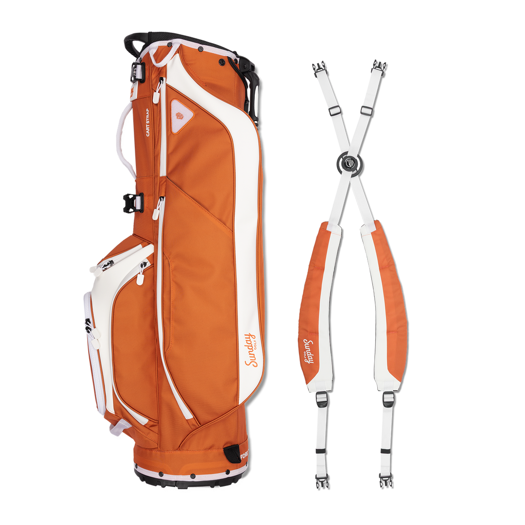 A full shot of Ryder golf bag in burnt orange laying flat sideways