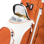 A close up shot of burnt orange Ryder golf bag's frosty pocket with canned drinks inside
